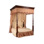 A mahogany and inlayed four post bed in George III style