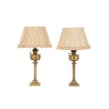 A pair of late Victorian gilt brass table oil lamps