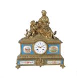 A French gilt metal and Sevres style porcelain mounted mantel clock