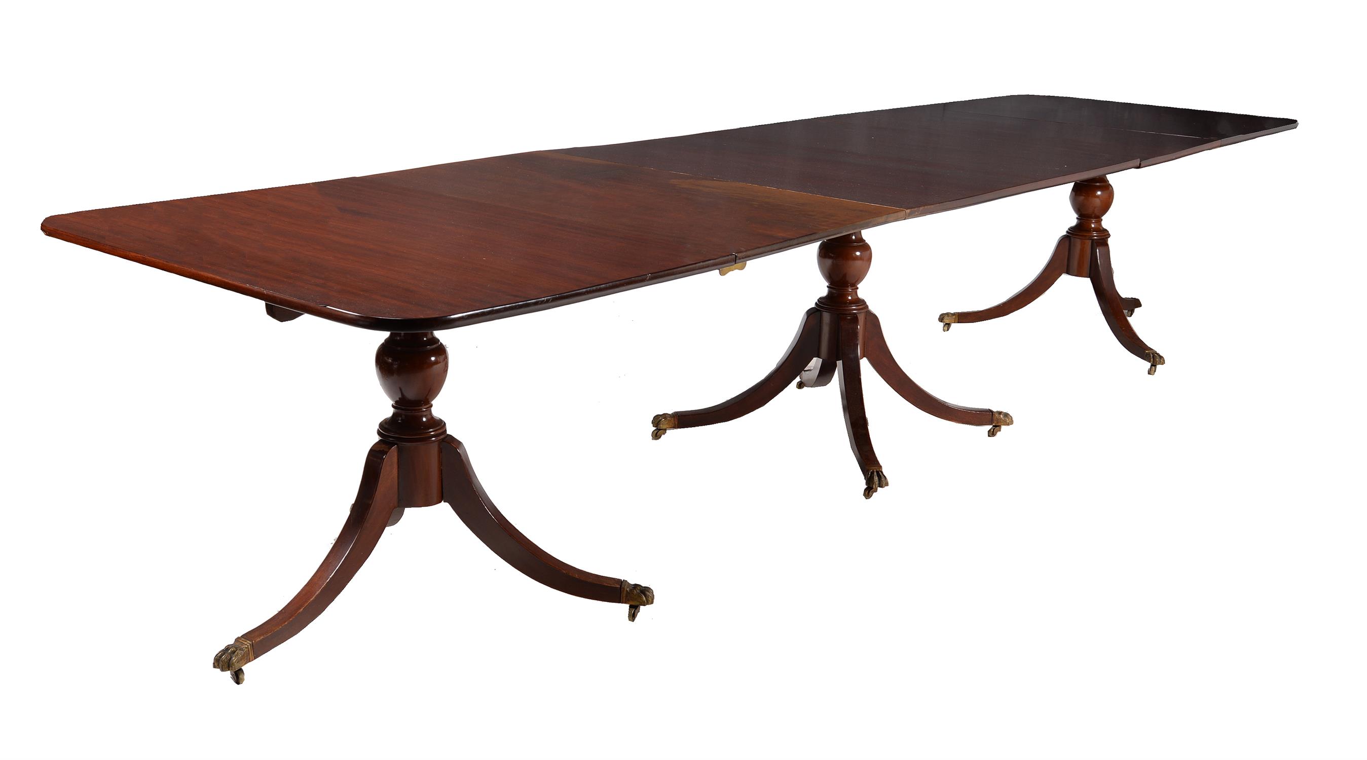 A mahogany triple pillar extending dining table