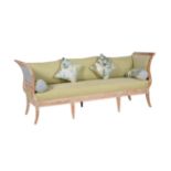 A distressed pine, composition and upholstered sofa