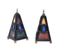 Y A pair of Italian sample marble and hardstone and ebony framed obelisks