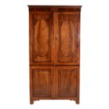 A Regency mahogany and ebonised inlaid wardrobe