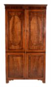 A Regency mahogany and ebonised inlaid wardrobe