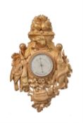 A French carved giltwood aneroid barometer in the 18th century taste