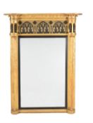 A George IV giltwood and parcel ebonised pier mirror
