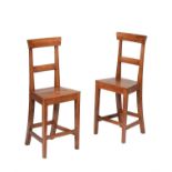 A pair of fruitwood correction chairs