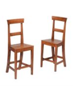 A pair of fruitwood correction chairs