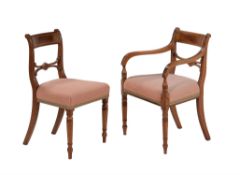 A matched set of twelve mahogany and brass inlaid dining chairs