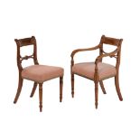 A matched set of twelve mahogany and brass inlaid dining chairs