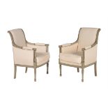 A pair of French green painted and upholstered bergere armchairs