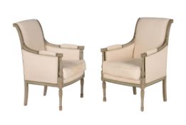 A pair of French green painted and upholstered bergere armchairs