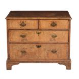 A walnut and feather banded chest of drawers
