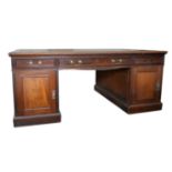 An Edwardian mahogany partners pedestal desk