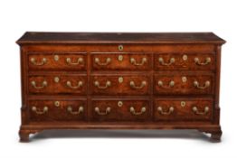 A George III oak and mahogany banded mule chest