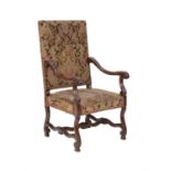 A walnut and tapestry upholstered armchair