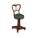 A late Regency mahogany music seat