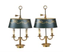 A pair of gilt metal and tole twin light table lamps in the manner of Louis Philippe bouillotte lamp