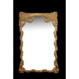 A giltwood and composition wall mirror