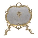 A French brass fire screen in Rococo taste