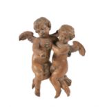 A German sculpted limewood figural group of cherubs