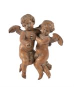 A German sculpted limewood figural group of cherubs