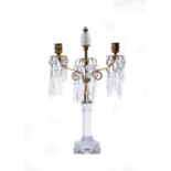 A Regency cut and moulded glass and gilt metal mounted twin light lustre candelabrum