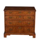 A walnut chest of drawers in George II style
