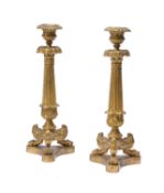 A pair of Louis Philippe gilt bronze and brass candlesticks