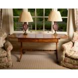 A Regency mahogany and inlaid sofa table