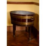 A George III mahogany and brass bound wine cooler