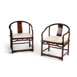 A pair of Chinese hardwood armchairs