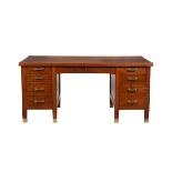 A figured hardwood pedestal desk