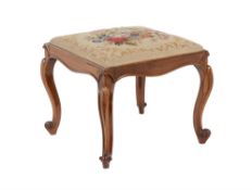 Y An early Victorian rosewood and needlework upholstered stool