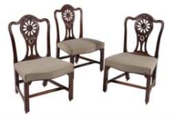 A set of three George III mahogany dining chairs