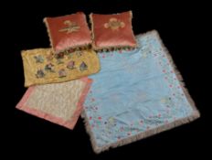 A pair of George III needlework embroidery fragments turned into cushions