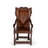 An oak wainscot chair in late 17th century style
