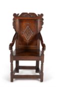 An oak wainscot chair in late 17th century style