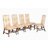 A set of five walnut and upholstered side chairs