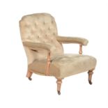 A late Victorian stripped walnut and upholstered low armchair