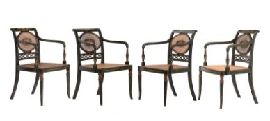 A set of four green painted elbow chairs in Regency style