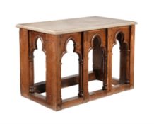 An oak and limestone mounted side table in Gothic taste