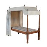 A mahogany child's four poster bed