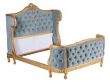 A French carved and gilded double bedstead