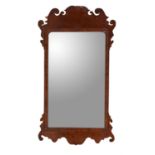 A George III walnut fretwork wall mirror