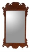 A George III walnut fretwork wall mirror