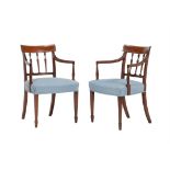 A pair of George III mahogany elbow chairs