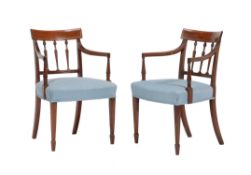 A pair of George III mahogany elbow chairs