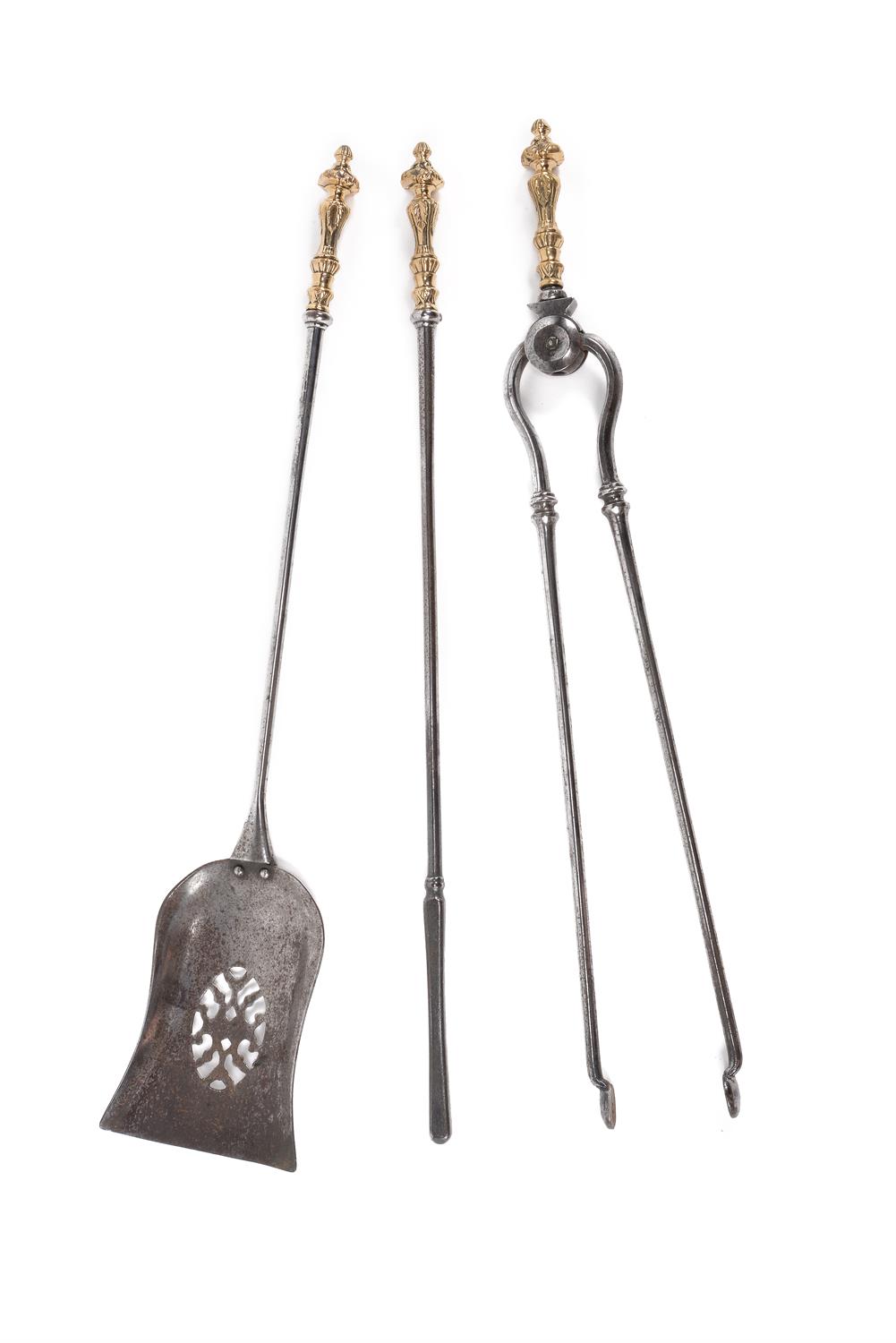 A set of William IV or early Victorian steel and brass mounted fire tools