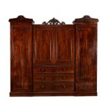 A William IV flame mahogany compactum wardrobe